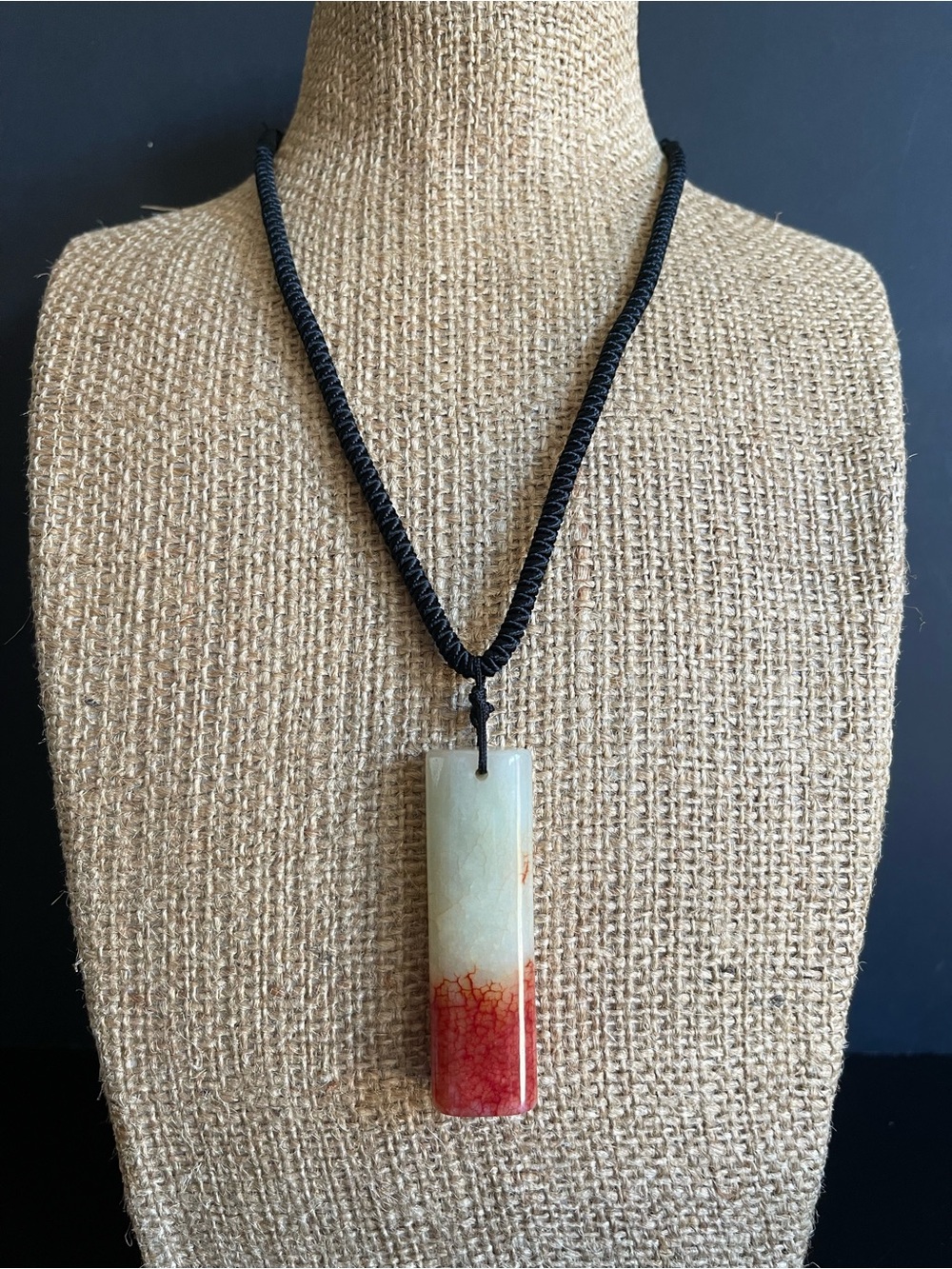 Chinese jade seal style pendant black cord necklace.